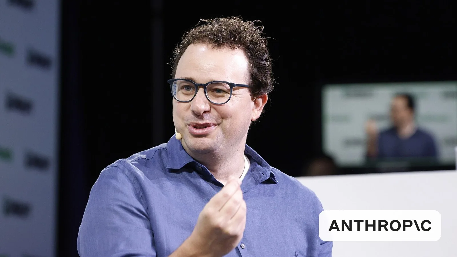Anthropic CEO Dario Amodei, with the Anthropic logo