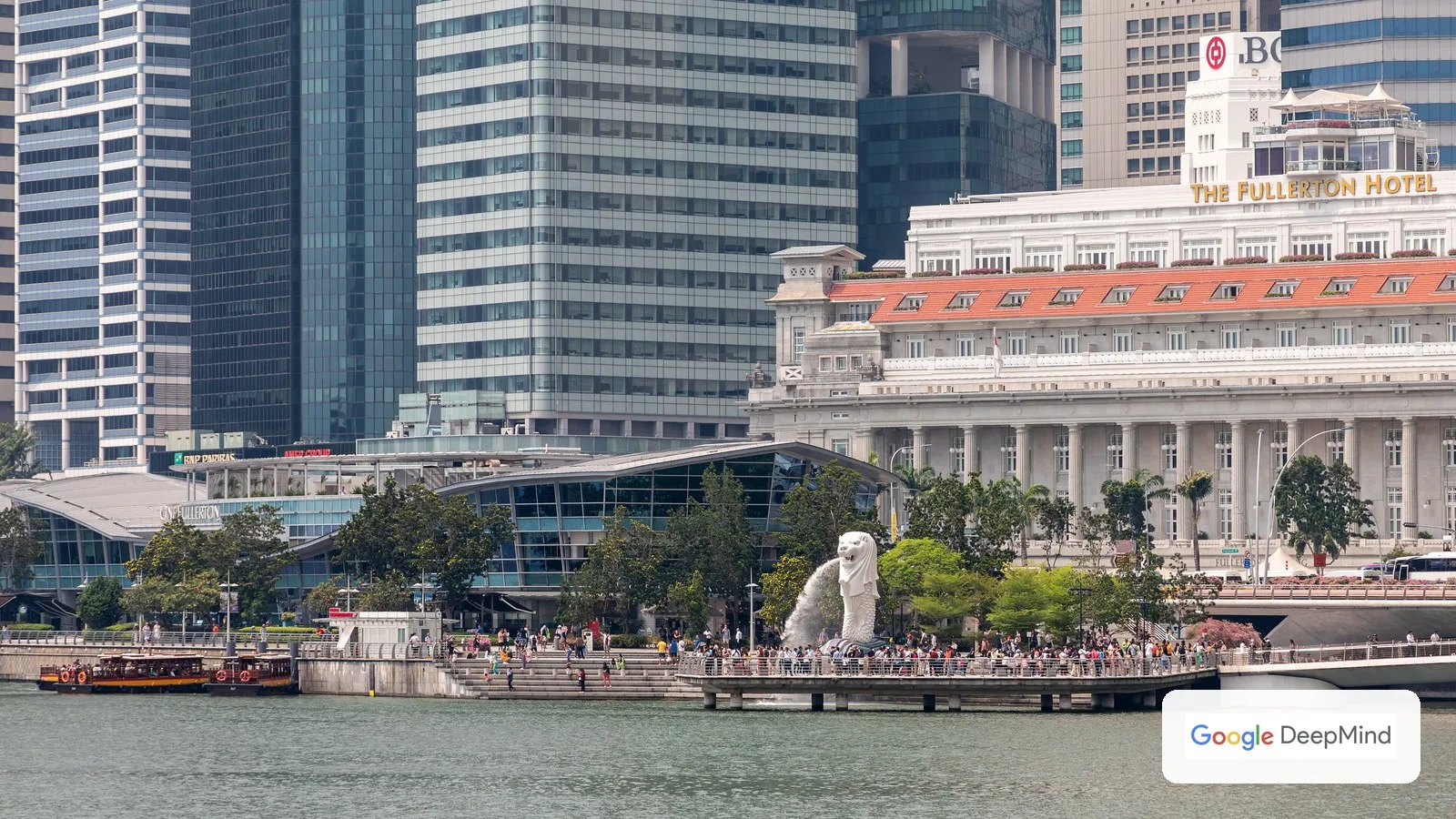The Merlion and Fullerton Hotel on Singapore's waterfront, with the Google DeepMind logo