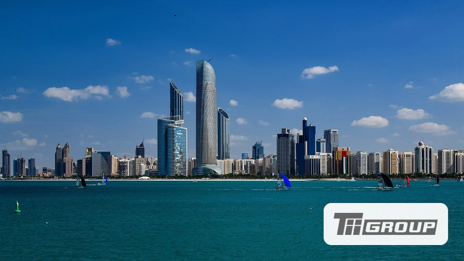 The Abu Dhabi skyline, with the Technology Innovation Institute logo