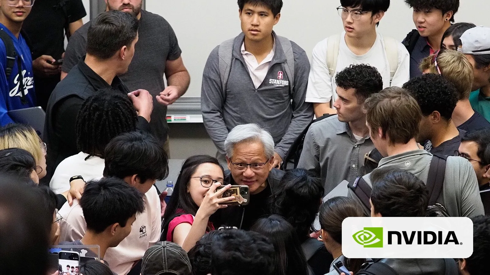 NVIDIA CEO Jensen Huang, with the NVIDIA logo