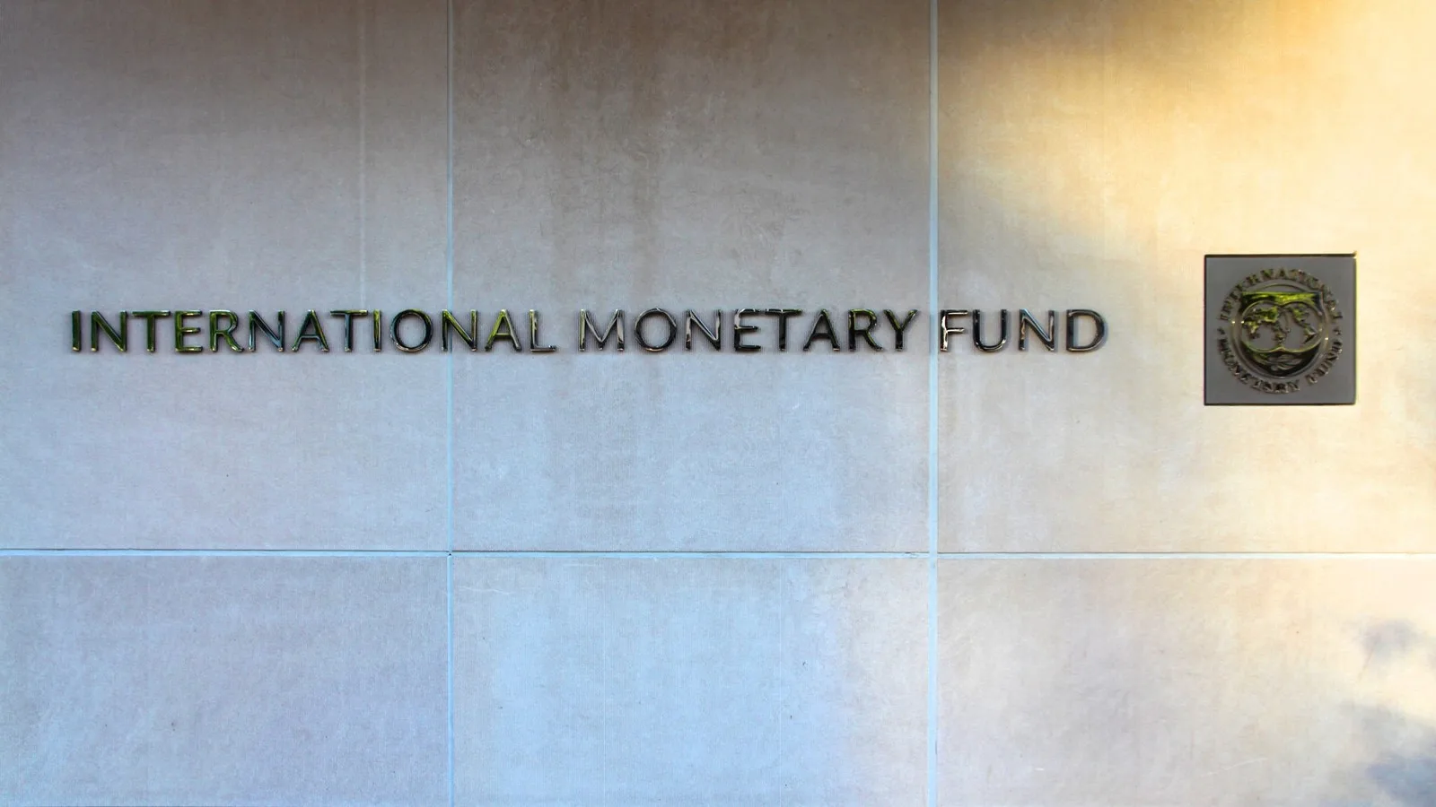 The International Monetary Fund name and seal on the wall of its headquarters in Washington, D.C.