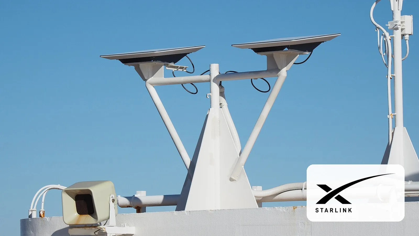 A Starlink dish, with the Starlink logo
